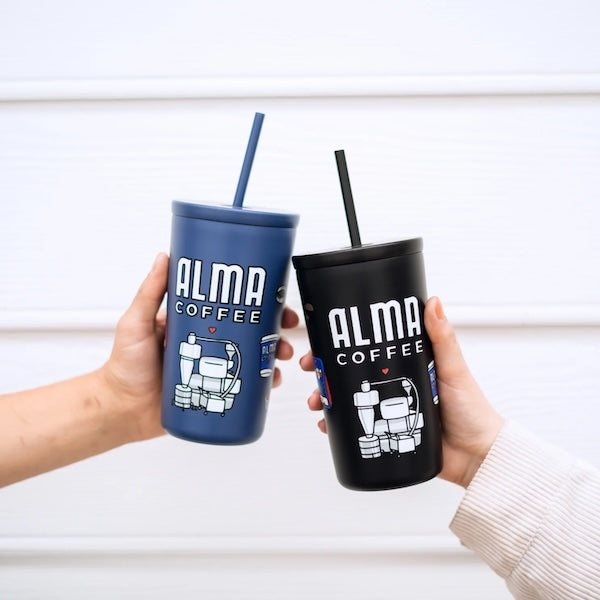 blue alma coffee reusable cup and black alma coffee reusable cup in a cheers position
