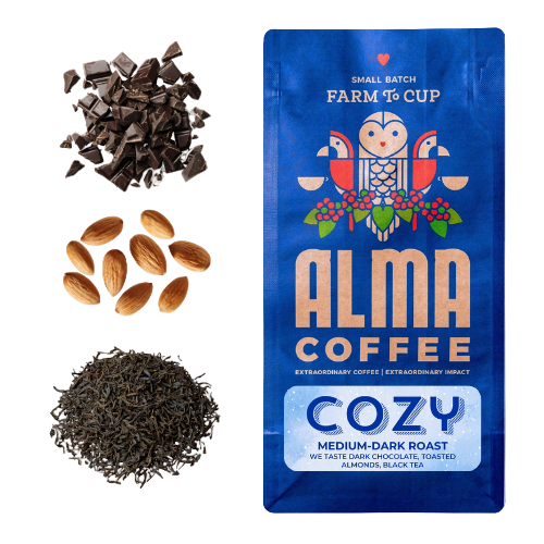 Alma Coffee Cozy package with coffee beans, chocolate pieces, and almonds on a white background