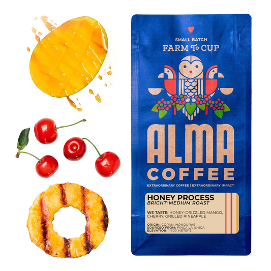 Alma Coffee package with honey process description, surrounded by mango, cherries, and grilled pineapple.