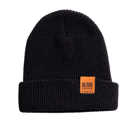black knitted beanie with leather stamped alma coffee logo
