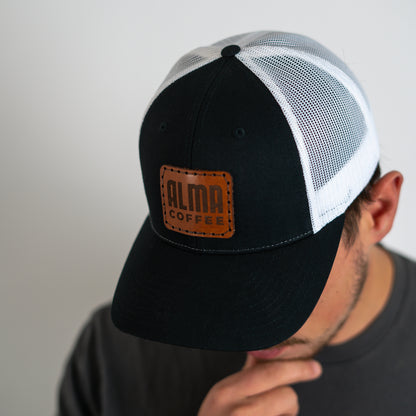 hand stitched leather logo hat by alma coffee
